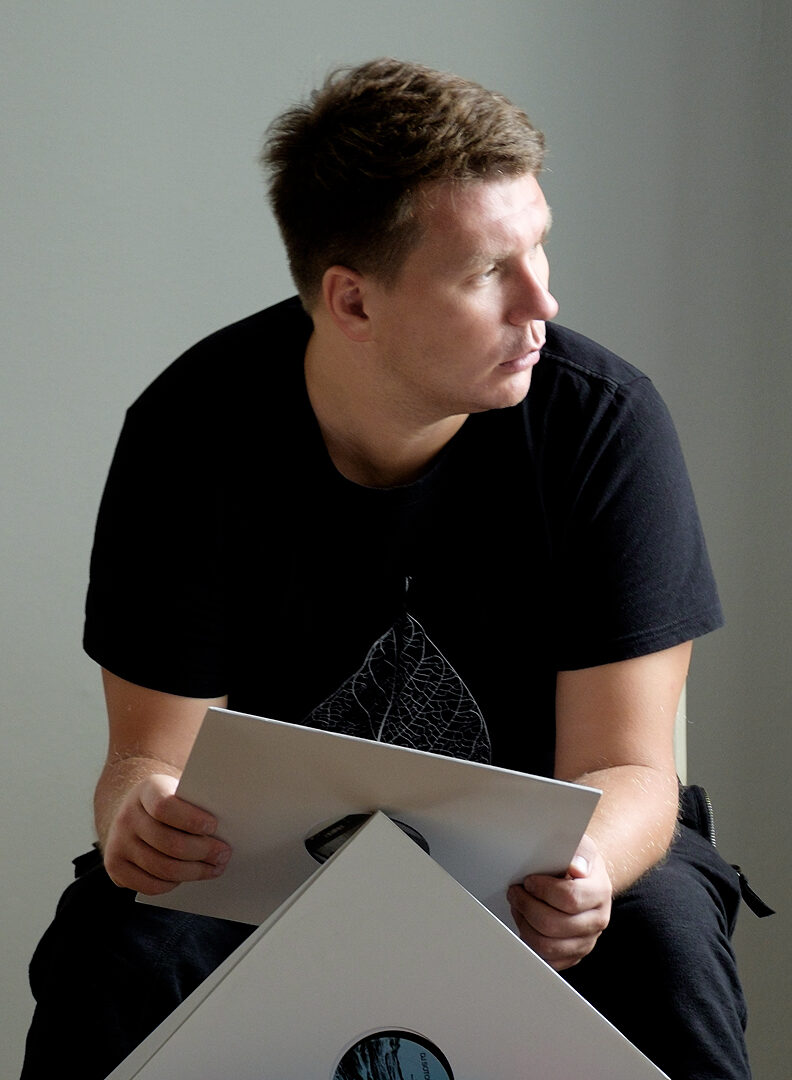 Portrait of Andrey Pushkarev holding a vinyl record, Moscow, 2016