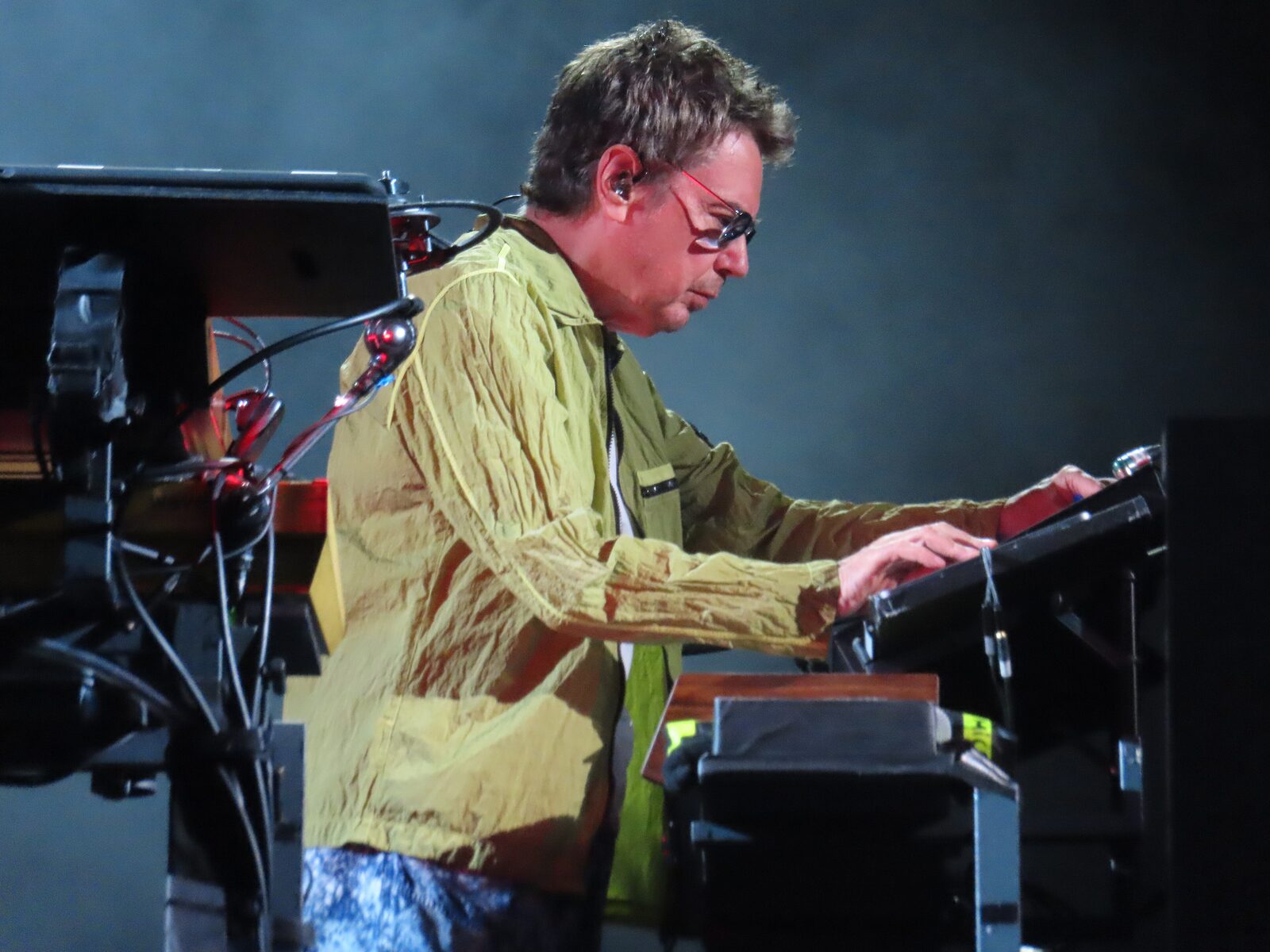 Jean-Michel Jarre playing keyboards on stage at a concert in Budapest in 2025