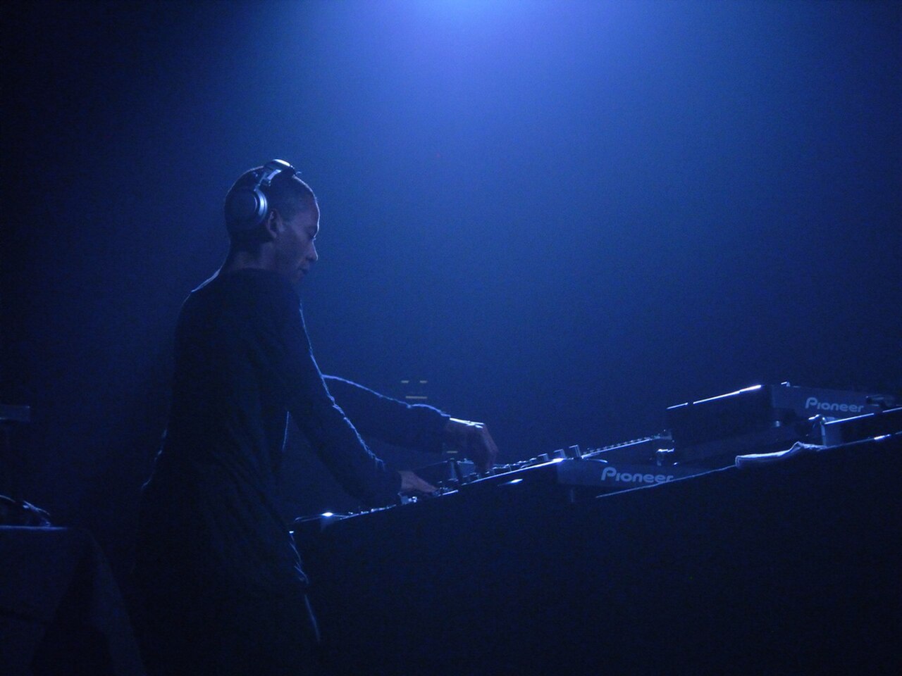 Jeff Mills silhouetted while DJing on Pioneer equipment at the Mayday festival in Katowice, Poland, 2010