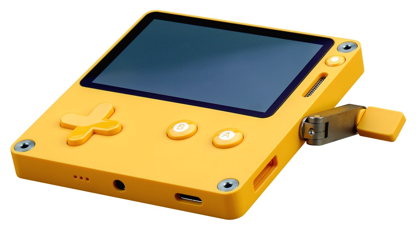 The Playdate handheld console in yellow with its mechanical crank, a device designed with Panic and credited to Teenage Engineering for the crank