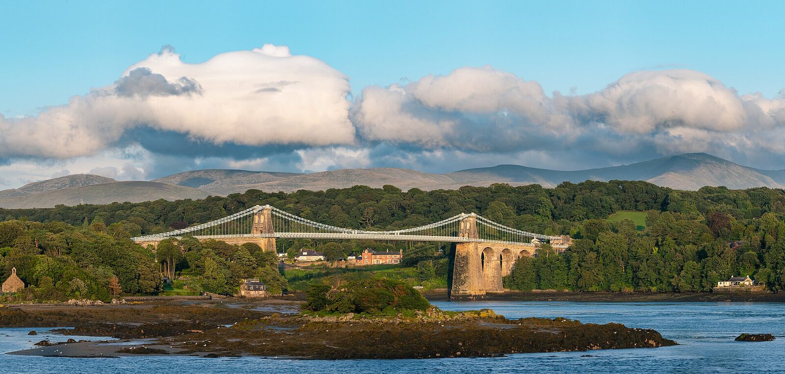 The Menai Suspension Bridge crossing the Menai Strait, the water between mainland Wales and Anglesey, where Gottwood Festival is held.