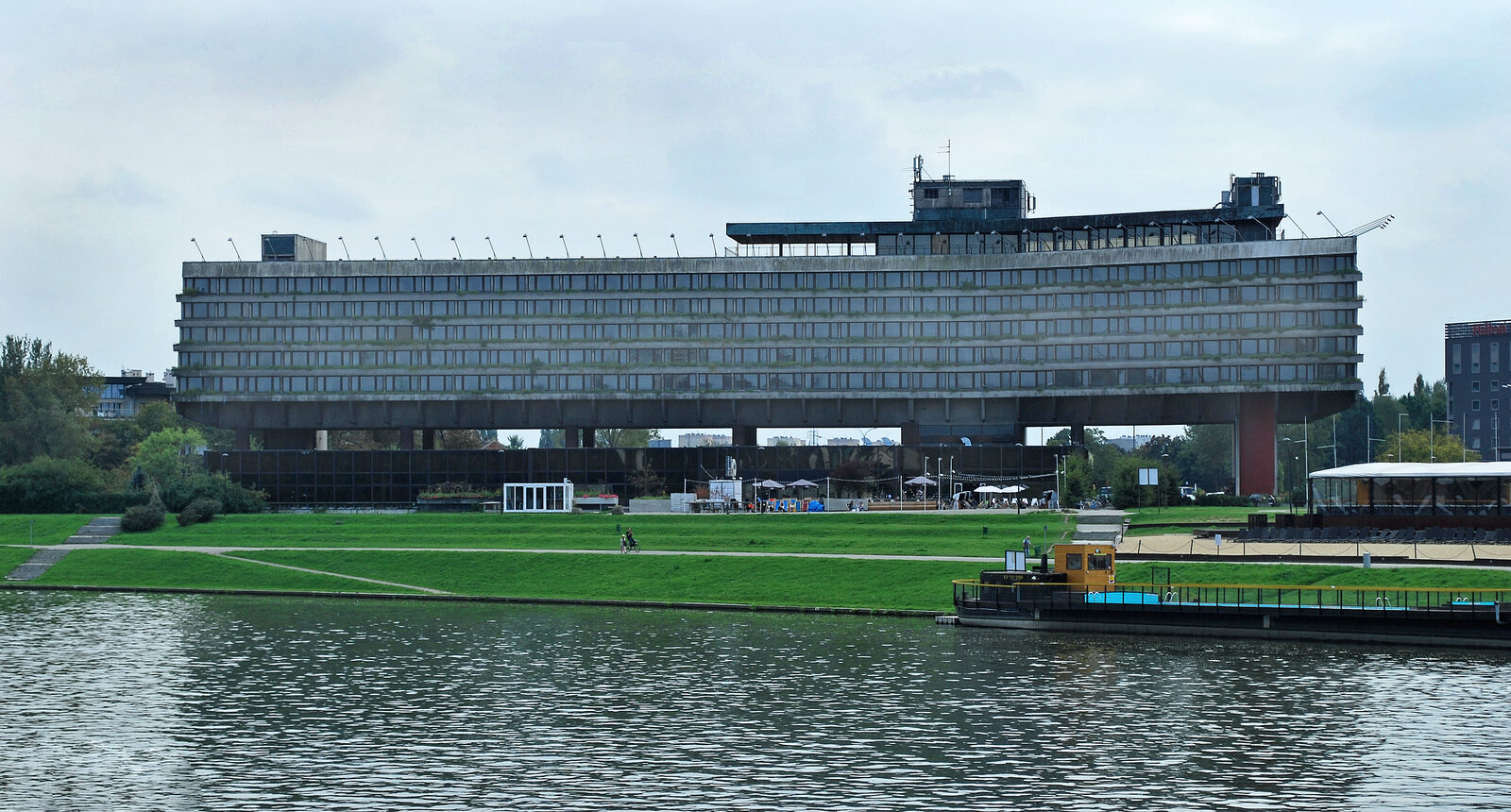 The former Forum Hotel in Kraków seen from across the Vistula, the brutalist building that hosts Unsound's late-night programme.