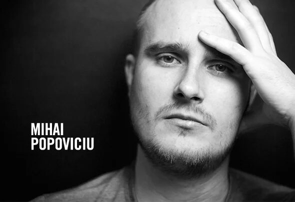 Black and white portrait of Mihai Popoviciu resting one hand against his forehead, with his name printed beside him